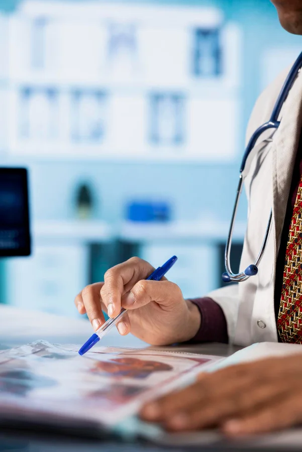 A medical professional reviewing information