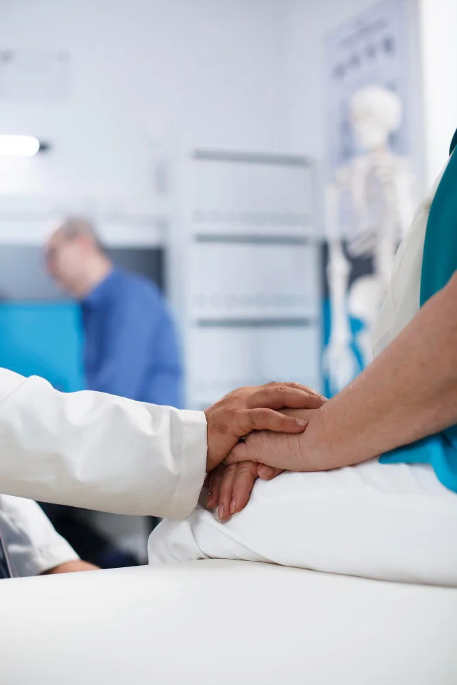 A healthcare professional supporting a patient